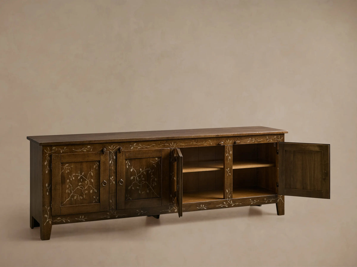 Front view of the dark brown Stefania Four-Door Buffet with hand-painted vine decor, two left doors closed, two right doors open revealing shelves.