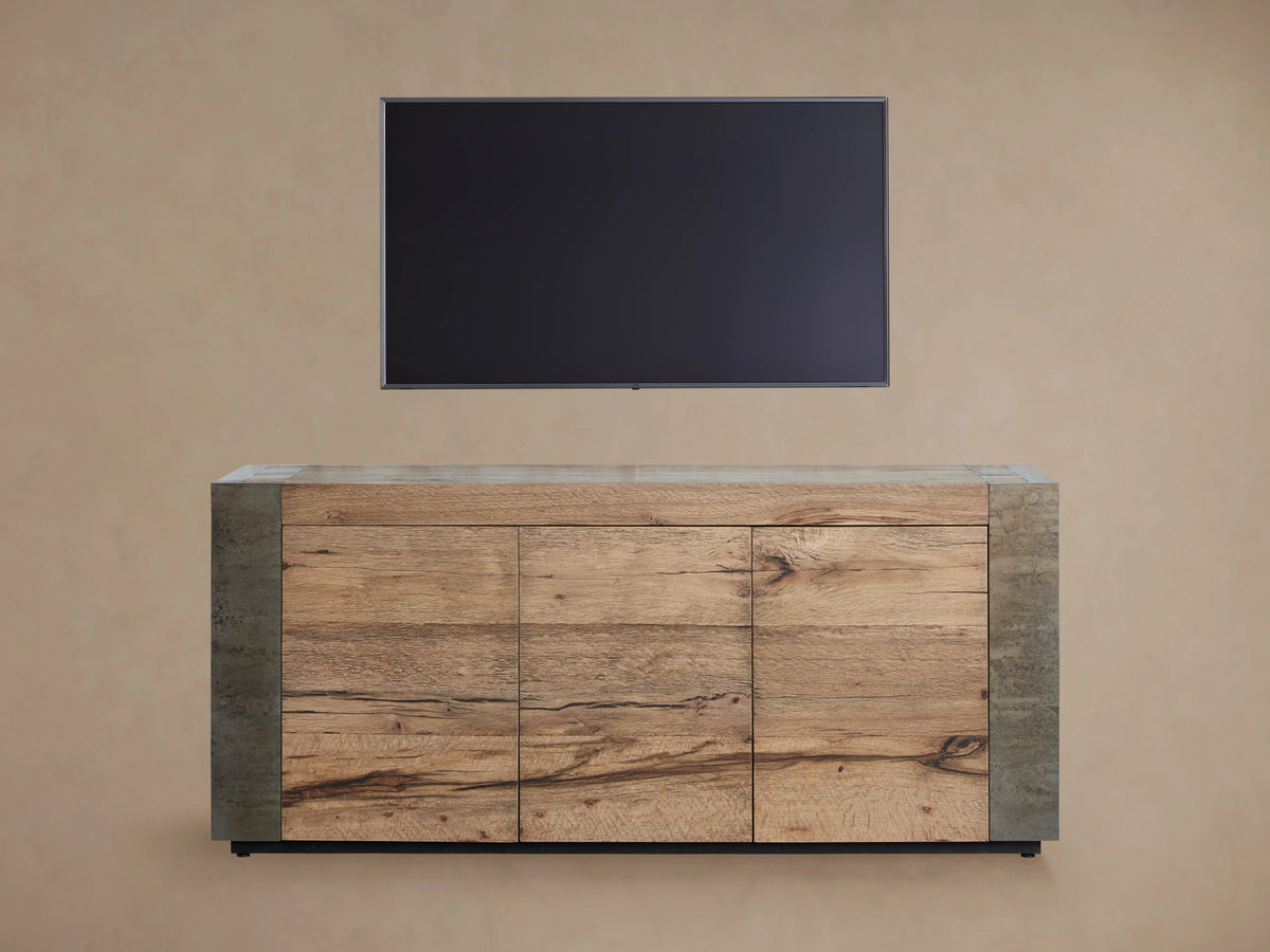 Telluride Media Console with a natural oak wood finish, three panel doors, and oxidized steel sides, placed against a plain background.