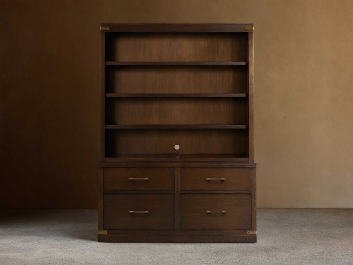 Dark brown Tremont Bookcase with four upper shelves, four lower drawers, and antique brass hardware.