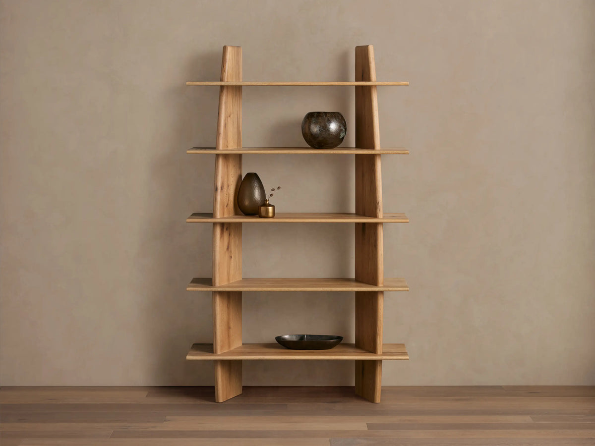 Viareggio Bookcase in natural oak wood with five shelves, featuring irregular organic wood patterns, holding decorative items.