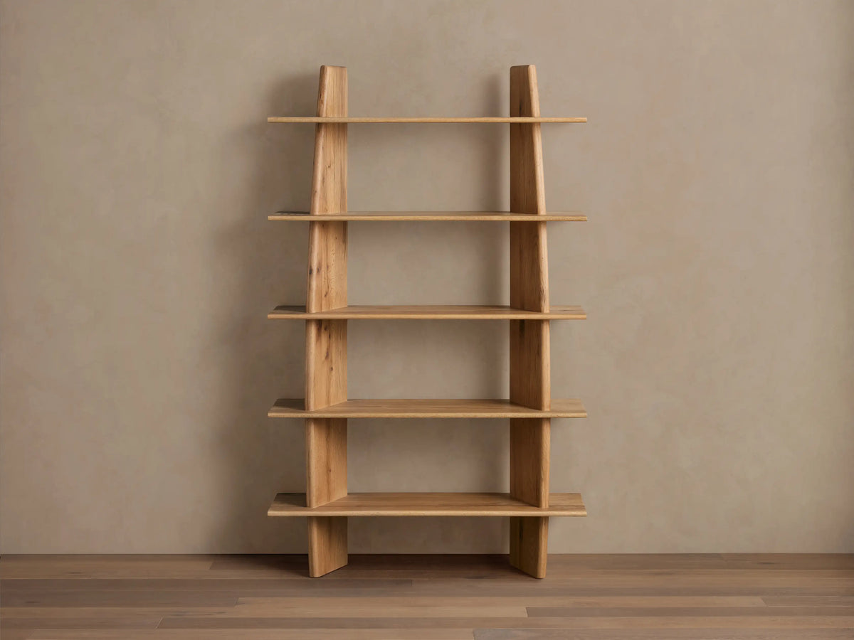 Viareggio Bookcase with five asymmetrically arranged fixed oak shelves, featuring a distinctive slanted design against a neutral backdrop.