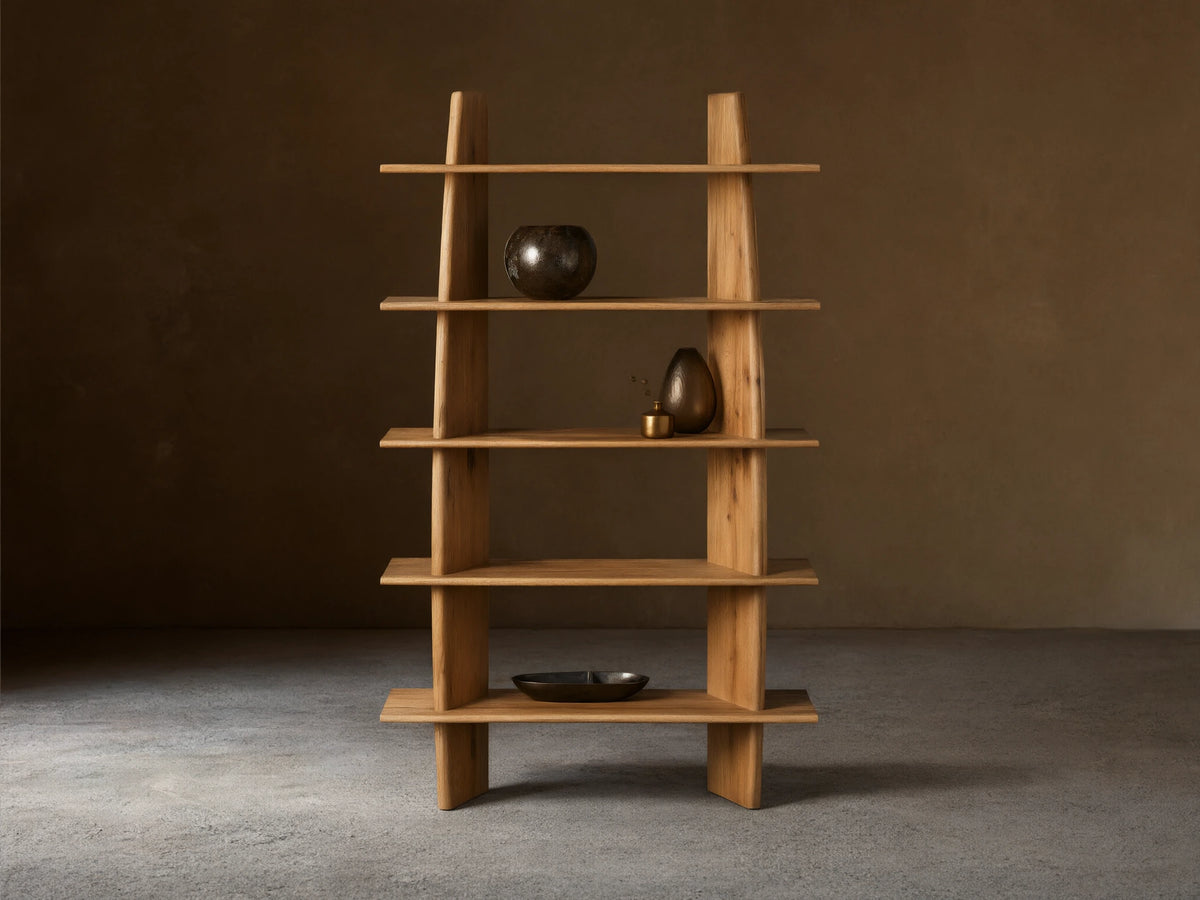 Viareggio Bookcase made of solid oak wood with five fixed shelves, displaying decorative items, against a beige wall.