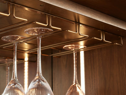 Open Westyn Bar Cabinet, dark wood interior, LED light illuminating bar tools on white marble, liquor, and wine bottles.