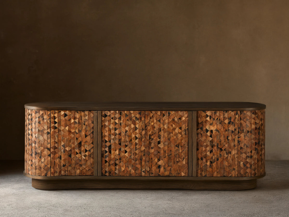 Zansi Sideboard with dark top, curved sides, 3 doors featuring a mosaic of varied brown and black horn and wood triangles.