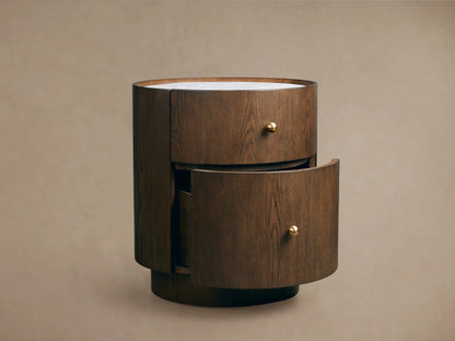 Ashbrook Nightstand in mocha finish with white Carrara marble top. Features two drawers, open bottom drawer, and brass pulls.
