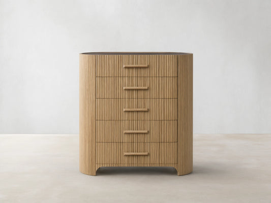 Astor Five-Drawer Dresser with oak wood reeding and natural stone top, featuring five horizontal drawers with stone pulls.