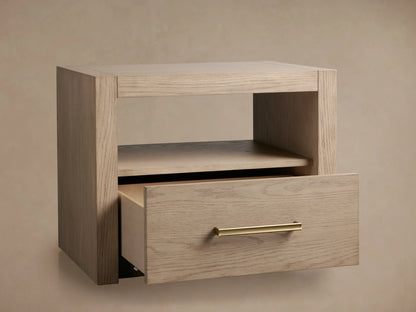 Bodhi Open Nightstand made from solid white oak with a visible wood grain. Features an open shelf and a partially open drawer with champagne brass handle.