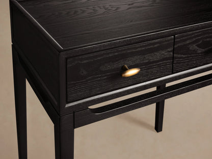 Brock Nightstand made of dark stained ash wood with brushed brass knob, sleek design, and visible wood grain pattern.