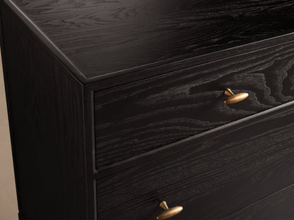 Brock Seven-Drawer Dresser showing dark ash wood finish with visible grain, featuring brushed brass handles.