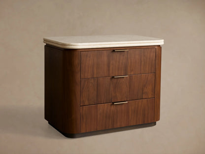 Caden Nightstand: Dark brown walnut veneer nightstand with rounded corners, a light stone top, and 3 drawers with antique bronze pulls.