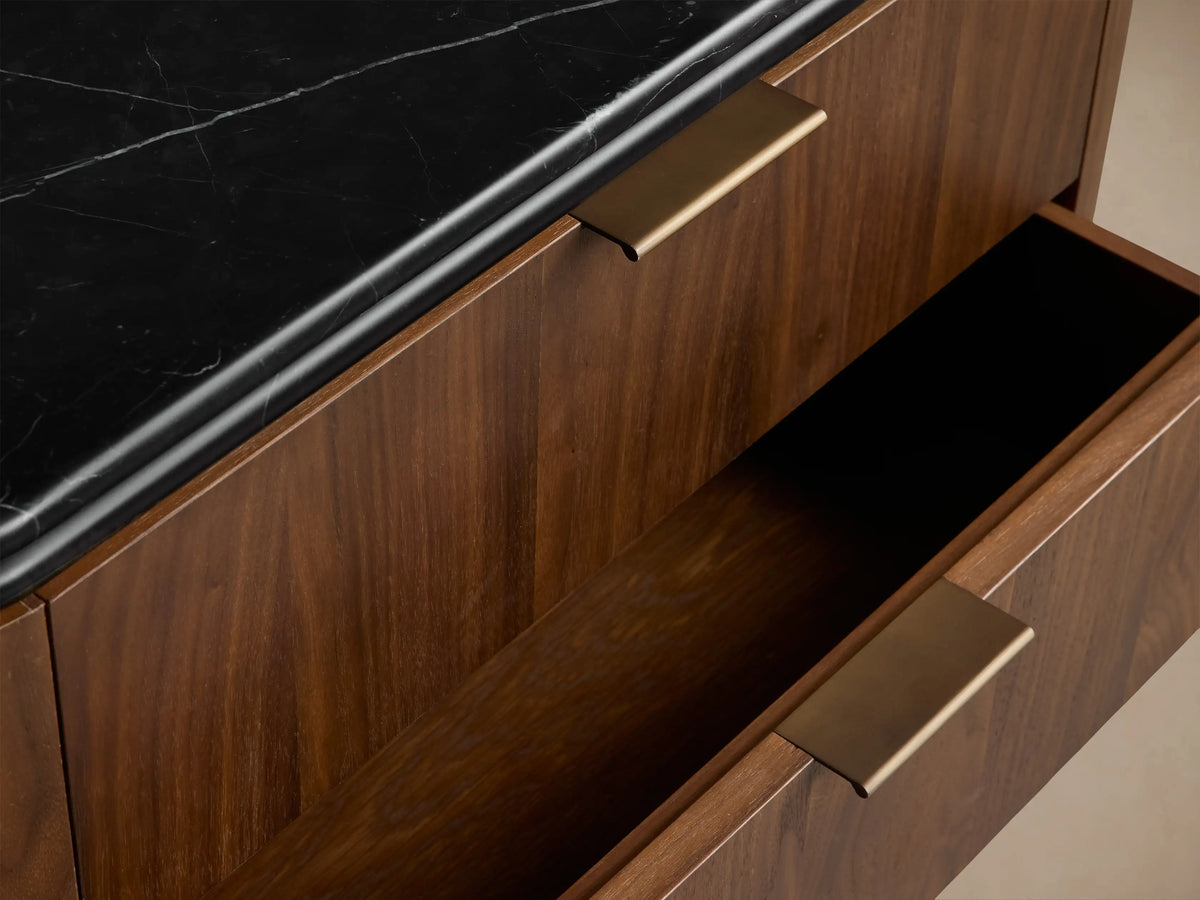 Caden Nightstand: Light walnut wood veneer with rounded corners, a black stone top, and 3 drawers with antique bronze pulls.