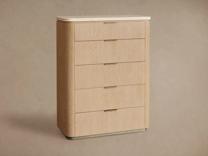 Close-up of Caden dresser, light sand oak veneer with grain, rounded beige stone top. Top drawer closed, second open with pewter pulls.