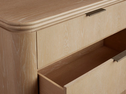 Front view of the Sand Caden Wood Five-Drawer Dresser, oak veneer, with five drawers, pewter edge-pull hardware, and rounded corners.