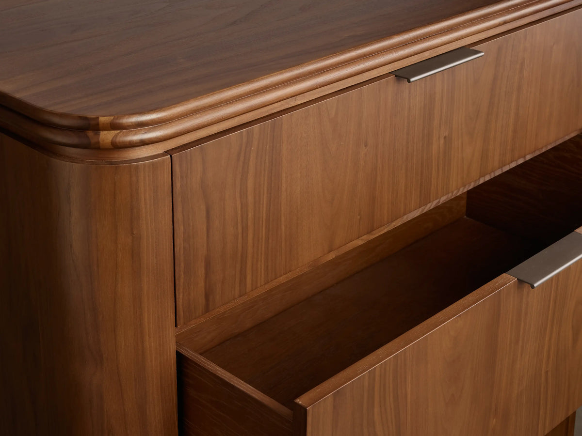 Front view of the walnut Caden Wood Five-Drawer Dresser with five drawers and antique bronze edge-pull hardware.