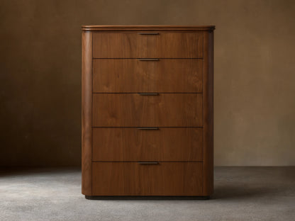 Front view of the walnut Caden Wood Five-Drawer Dresser with five drawers, antique bronze edge-pull hardware, and rounded edges.