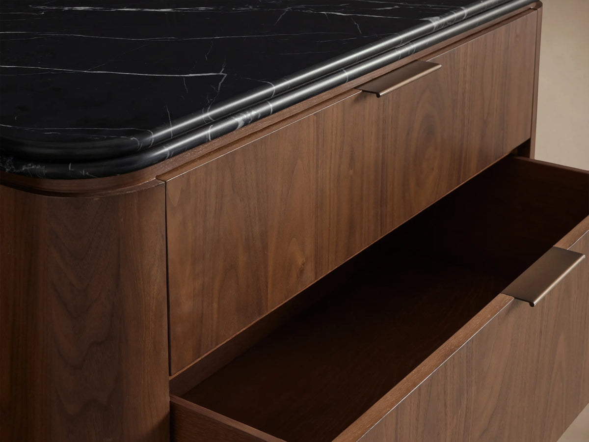 Caden Five-Drawer Dresser: light walnut wood veneer, black stone top, 5 drawers with antique bronze edge-pulls, rounded corners.
