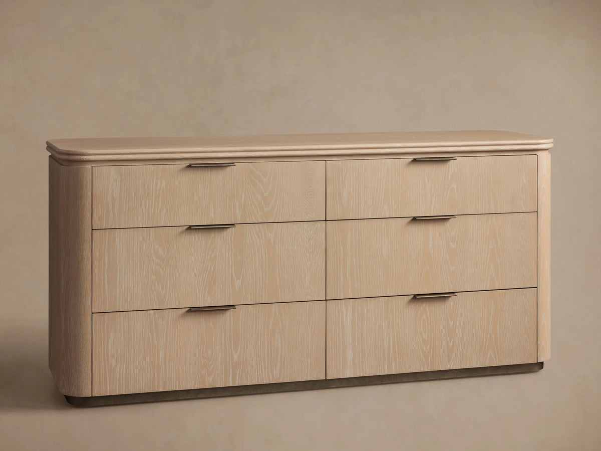 Front view of the Caden Wood Six-Drawer Dresser in sand finish with rounded edges and pewter edge-pull hardware.