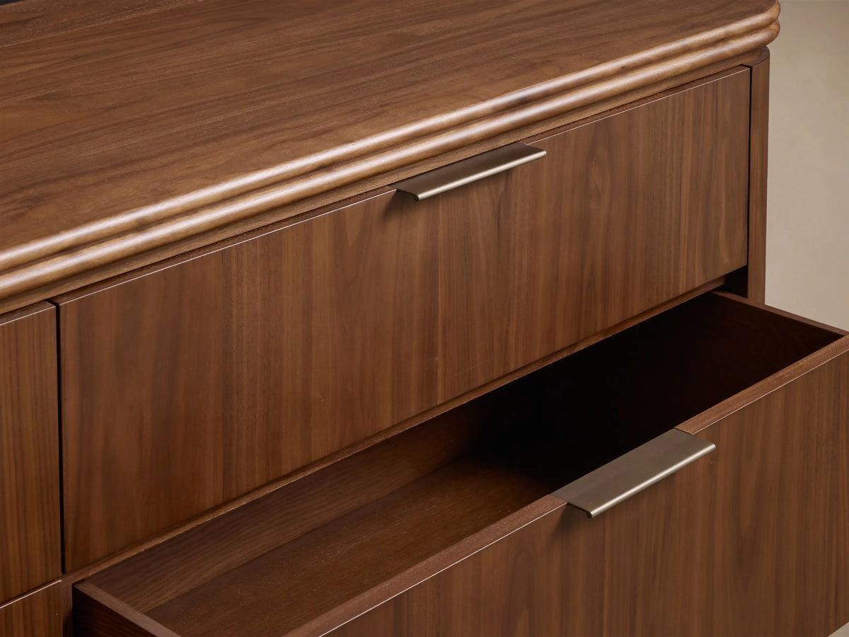 Front view of the Walnut Caden Wood Six-Drawer Dresser with six drawers, curved top, and antique bronze hardware.