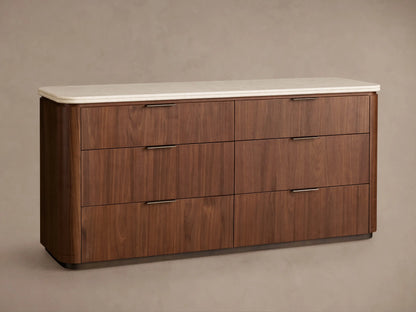 Caden Six-Drawer Dresser in light walnut wood, light stone top. Top drawer open showing antique bronze edge-pull hardware.