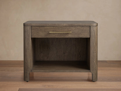 Calista Open Nightstand in veneered oak with a single drawer and open shelf, featuring a satin sheen and brass handle.