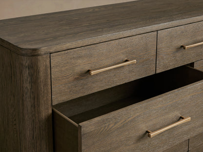 Calista Eleven-Drawer Dresser in oak with a satin sheen, featuring eleven drawers and sleek hardware, two drawers open.