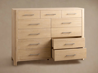 Calista Eleven-Drawer Dresser, light oak wood grain, featuring 3 small top drawers & 8 larger, with silver bar handles.