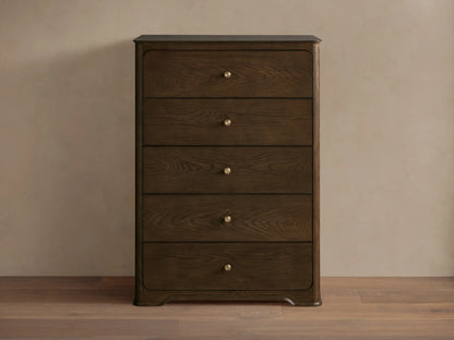 Dark brown oak Conley Five-Drawer Dresser with rounded edges, featuring five drawers each with a champagne brass pull.