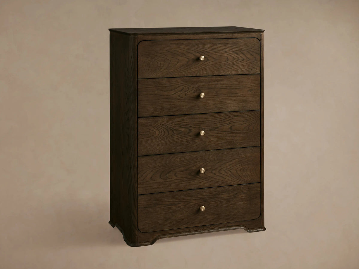 Dark brown oak Conley Five-Drawer Dresser with rounded edges, featuring five drawers each with a champagne brass pull.