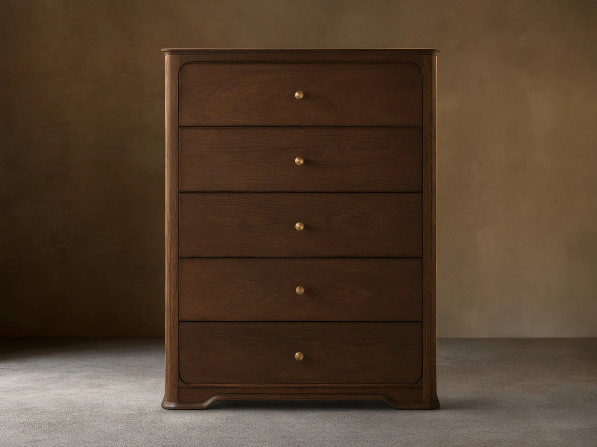 Dark brown oak Conley Five-Drawer Dresser with rounded edges, featuring five drawers each with a champagne brass pull.