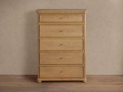 Carlisle Five-Drawer Dresser, light wood with visible grain, 5 drawers, small antique brass pulls, decorative reeding.