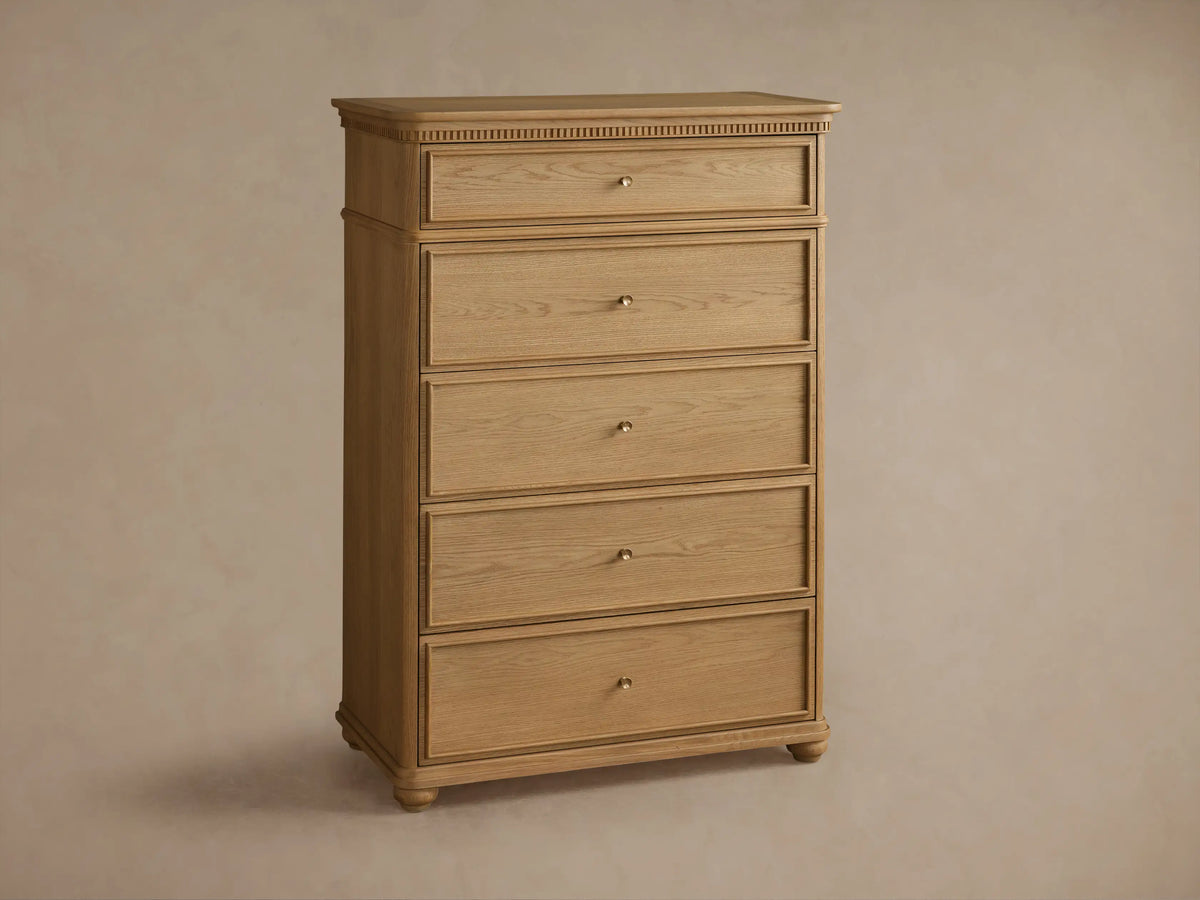 Carlisle Five-Drawer Dresser, light wood with visible grain, 5 drawers, small antique brass pulls, decorative reeding.