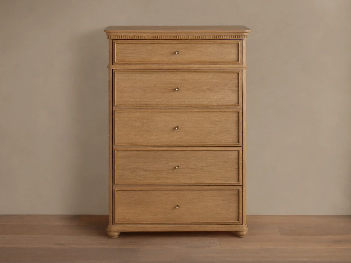 Carlisle Five-Drawer Dresser, light wood with visible grain, 5 drawers, small antique brass pulls, decorative reeding.