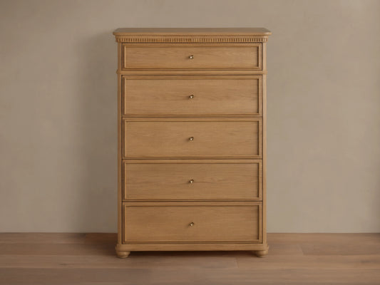 Carlisle Five-Drawer Dresser, light wood with visible grain, 5 drawers, small antique brass pulls, decorative reeding.