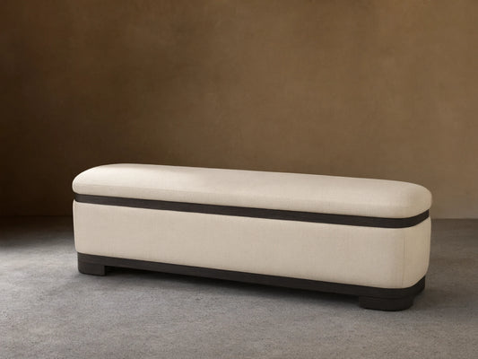 Front view of the Cream upholstered Darien Curved Storage Bench with a dark wood base and trim.