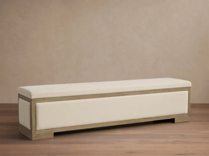 Front view of the Darien Storage Bench, featuring a light oak wood frame and cream upholstered top and front panel.