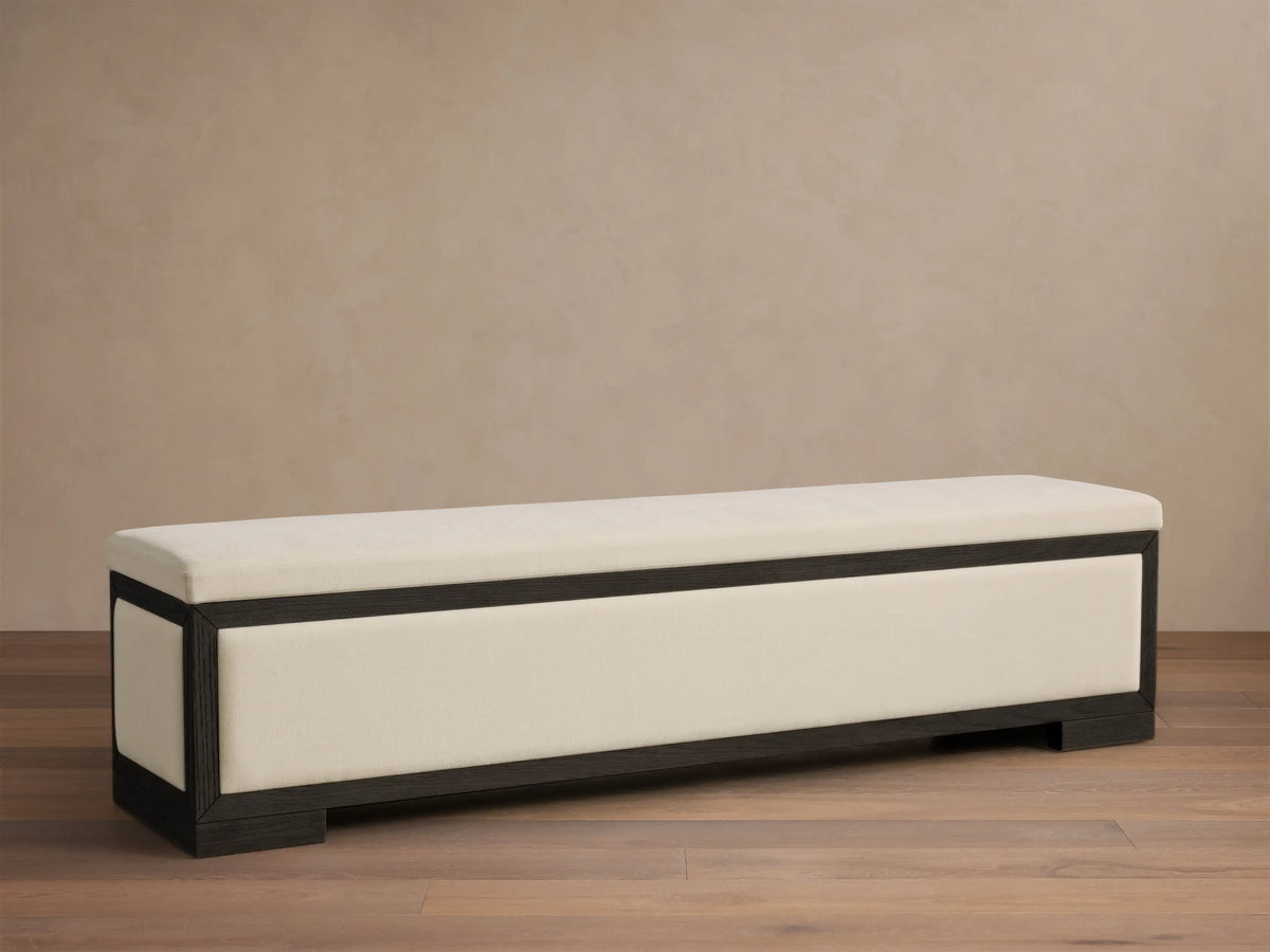 Front view of the Darien Storage Bench featuring a dark stained oak frame and cream upholstered top and front panel.