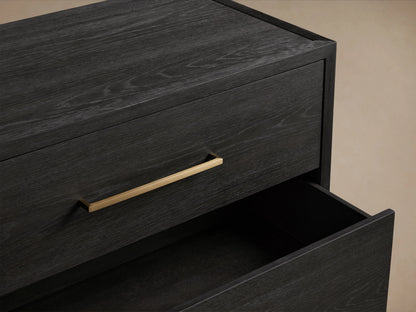 Darwyn Six-Drawer Dresser in dark oak finish features brass drawer pulls, partially open top drawer, showcasing wood grain.