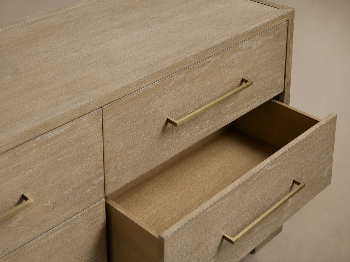 Front view of the light oak Darien Nine-Drawer Dresser with nine drawers and rectangular metal pull handles.