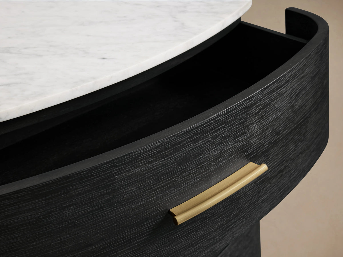 Danny Five-Drawer Dresser with open ebony-finished oak drawer, white marble top, and brass handle, showing soft-close glide.
