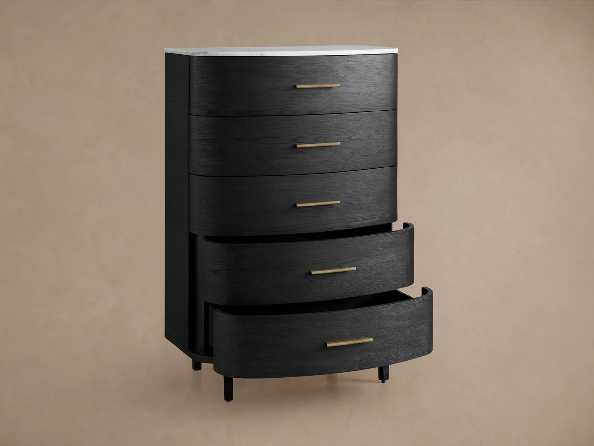 Danny Five-Drawer Dresser made of dark oak with brass pulls and cream marble top. Two lower drawers are open, showing spacious storage.