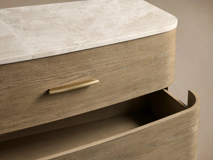 Danny Six-Drawer Dresser in oak with a fawn finish, featuring a white marble top and six drawers with brass pulls.