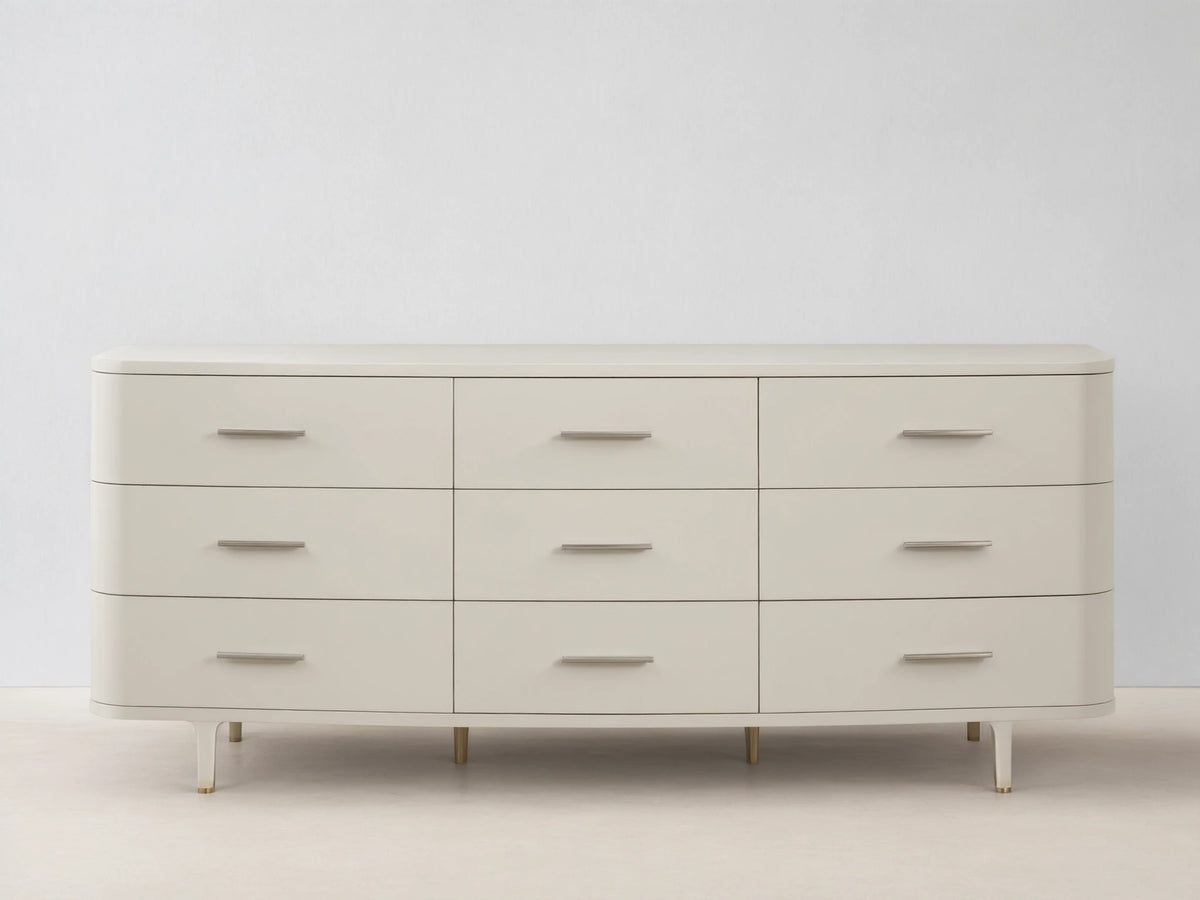 Danny Nine-Drawer Dresser in fumo, a light beige, with rounded corners, 9 drawers, and horizontal brass pulls.