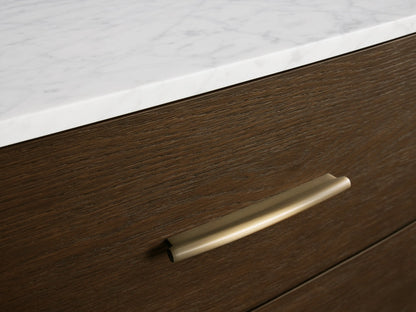 Danny Six-Drawer Dresser: Close-up of dark oak wood with a curved, partially open drawer and white marble top.