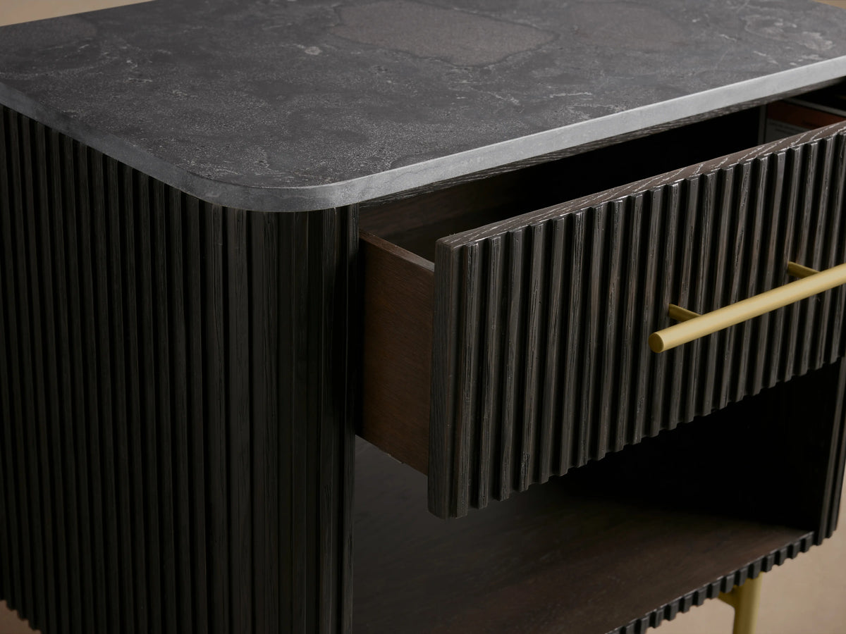 Finnley Open Nightstand in ebony finish with ribbed texture, featuring a large open shelf, spacious drawer with brass handle, and brass legs.