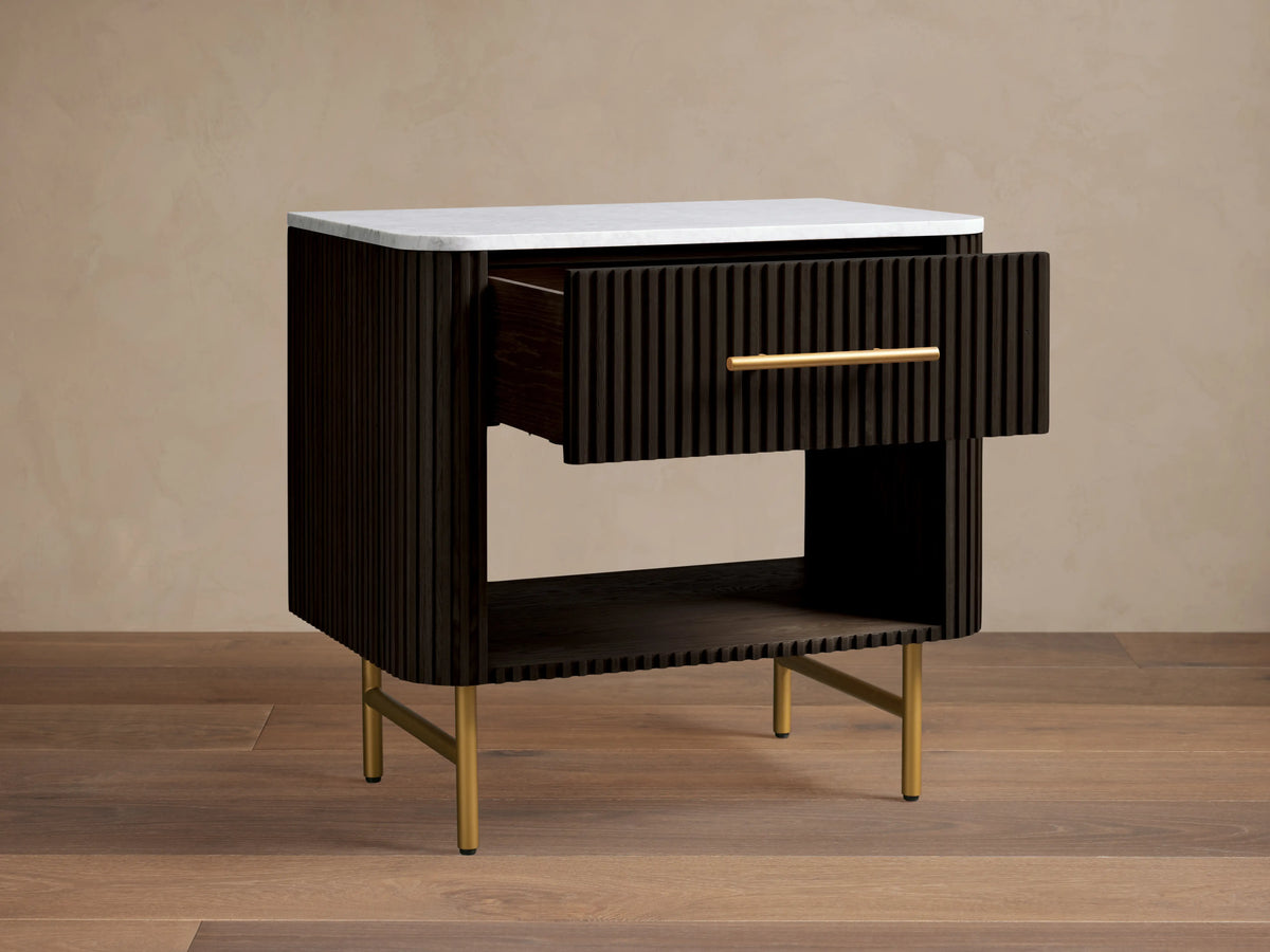 Finnley Open Nightstand with dark wood finish, white marble top, brass hardware, open shelf, and brass legs on a wooden floor.
