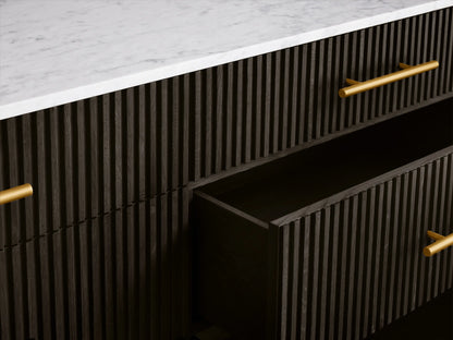 Finnley Six-Drawer Dresser with dark ebony reeded wood, white marble top, brass bar pulls, and angled gold legs.