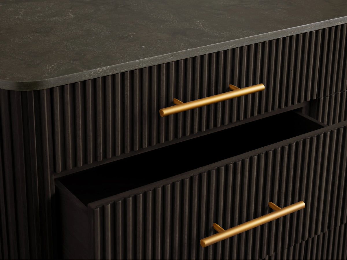 Finnley Nine-Drawer Dresser in dark finish with brass-finished handles. Three drawers are partially open, showing sleek design.