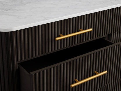 Finnley Nine-Drawer Dresser in dark wood with a white top. Features brass-finished handles and raised drawers on the right.