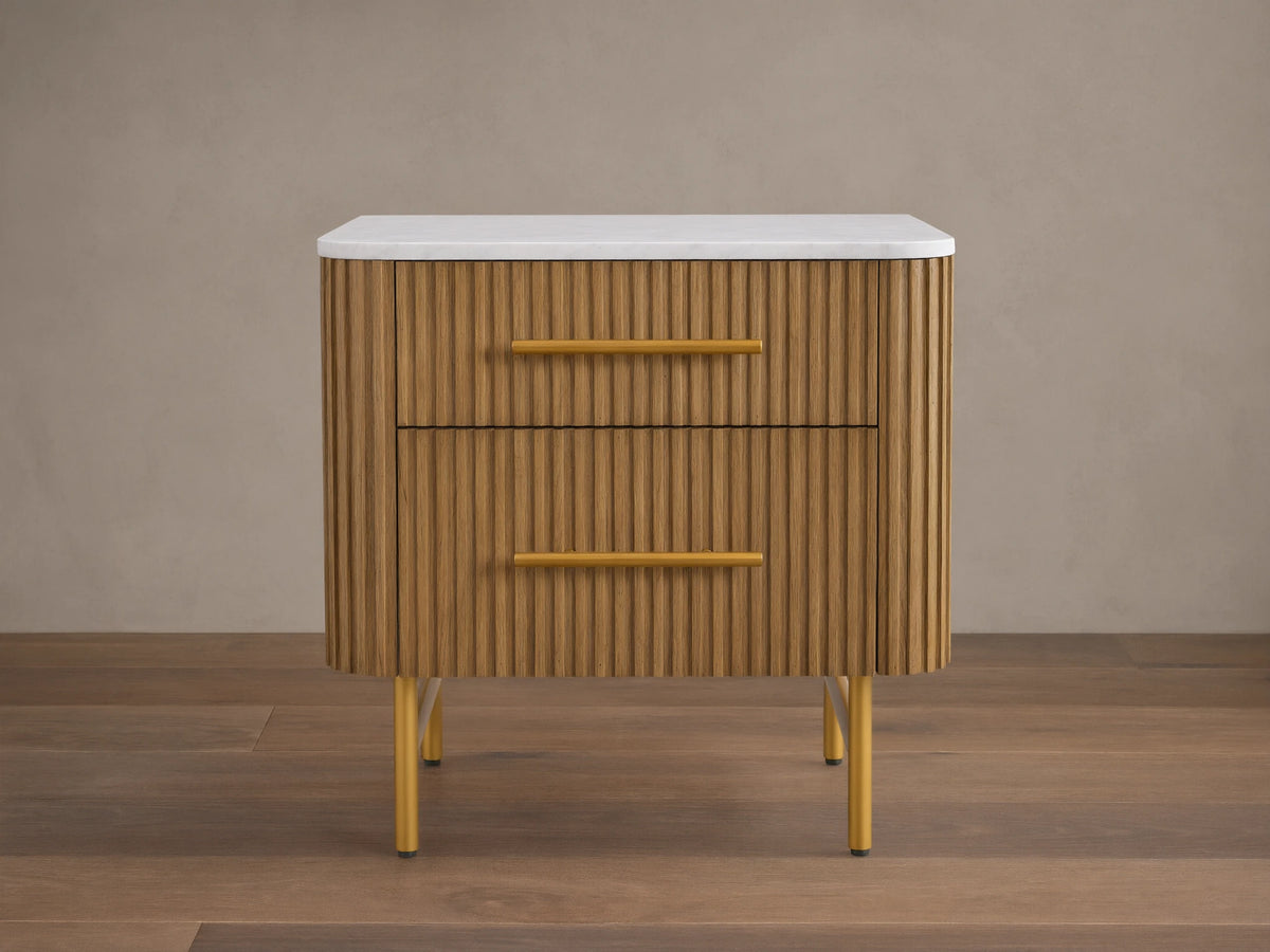 Mid-century style wooden nightstand with a white top, ribbed front, and yellow handles. It features two drawers and stands on yellow legs.