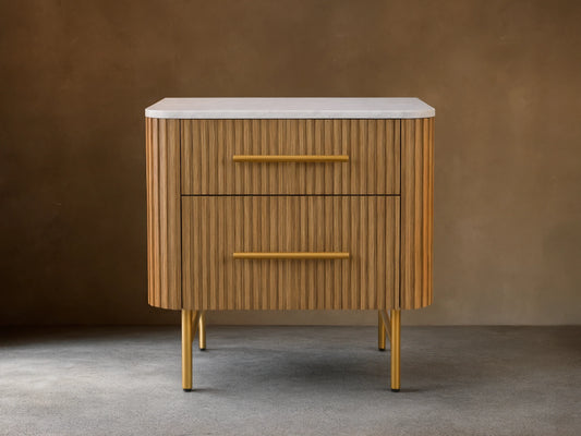 Mid-century style wooden nightstand with a white top, ribbed front, and yellow handles. It features two drawers and stands on yellow legs.